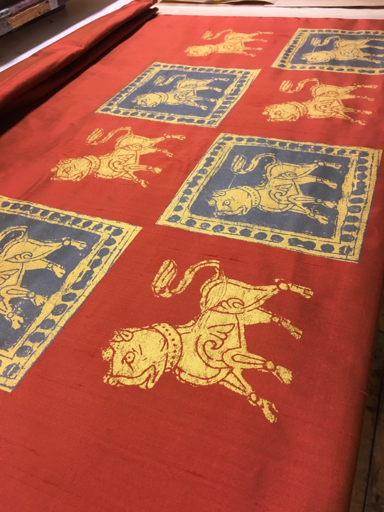 Dogs on red silk